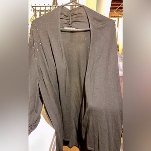 3/4 sleeve open cardigan with gold and silver stud embellishments.